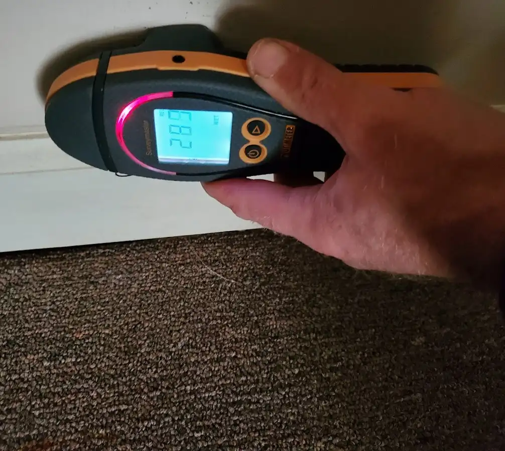 Moisture detection at baseboard during Storm Damage Restoration in Ridgeway